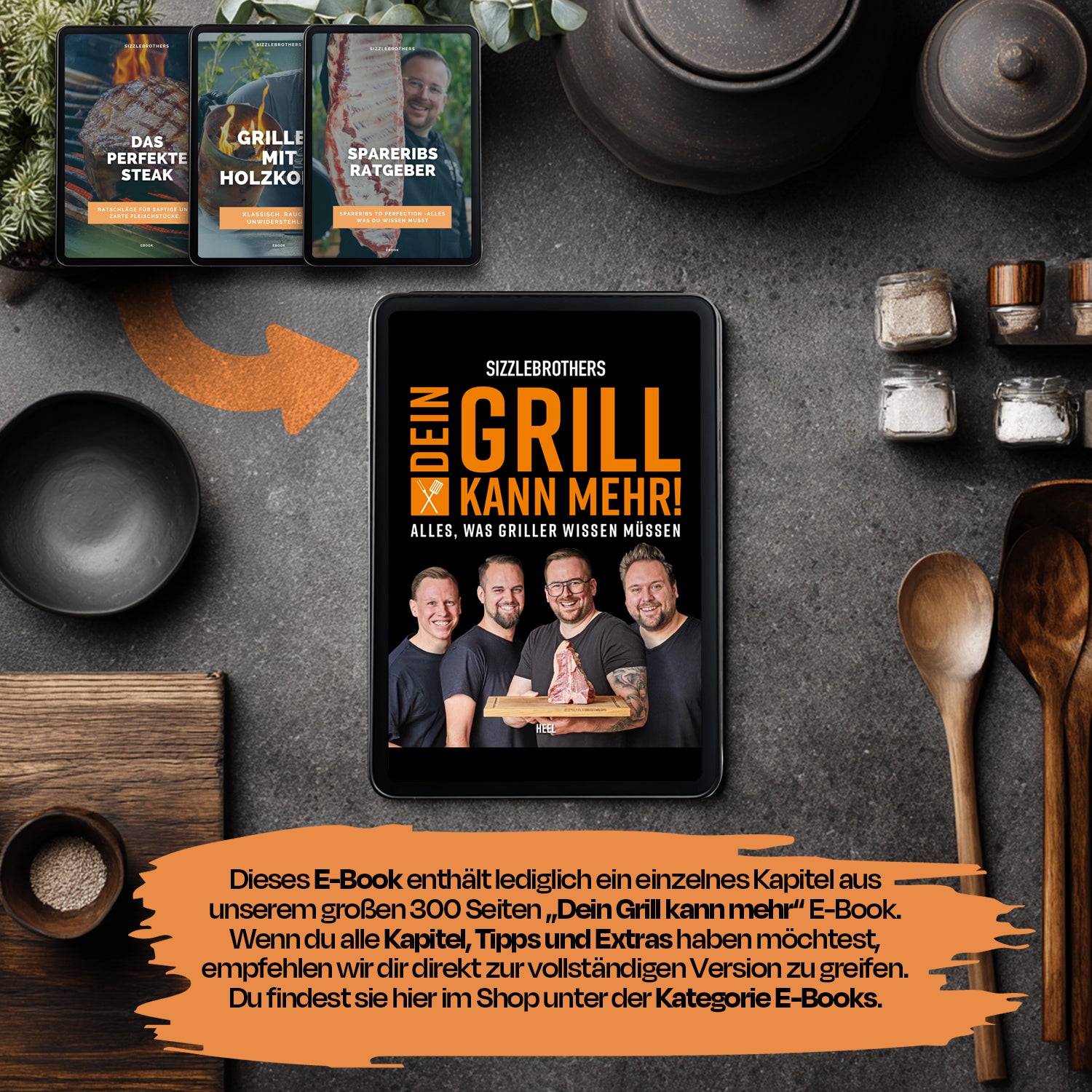 Ein Tablet mit einem Grillbuch vor Küchenzutaten und Gewürzen.